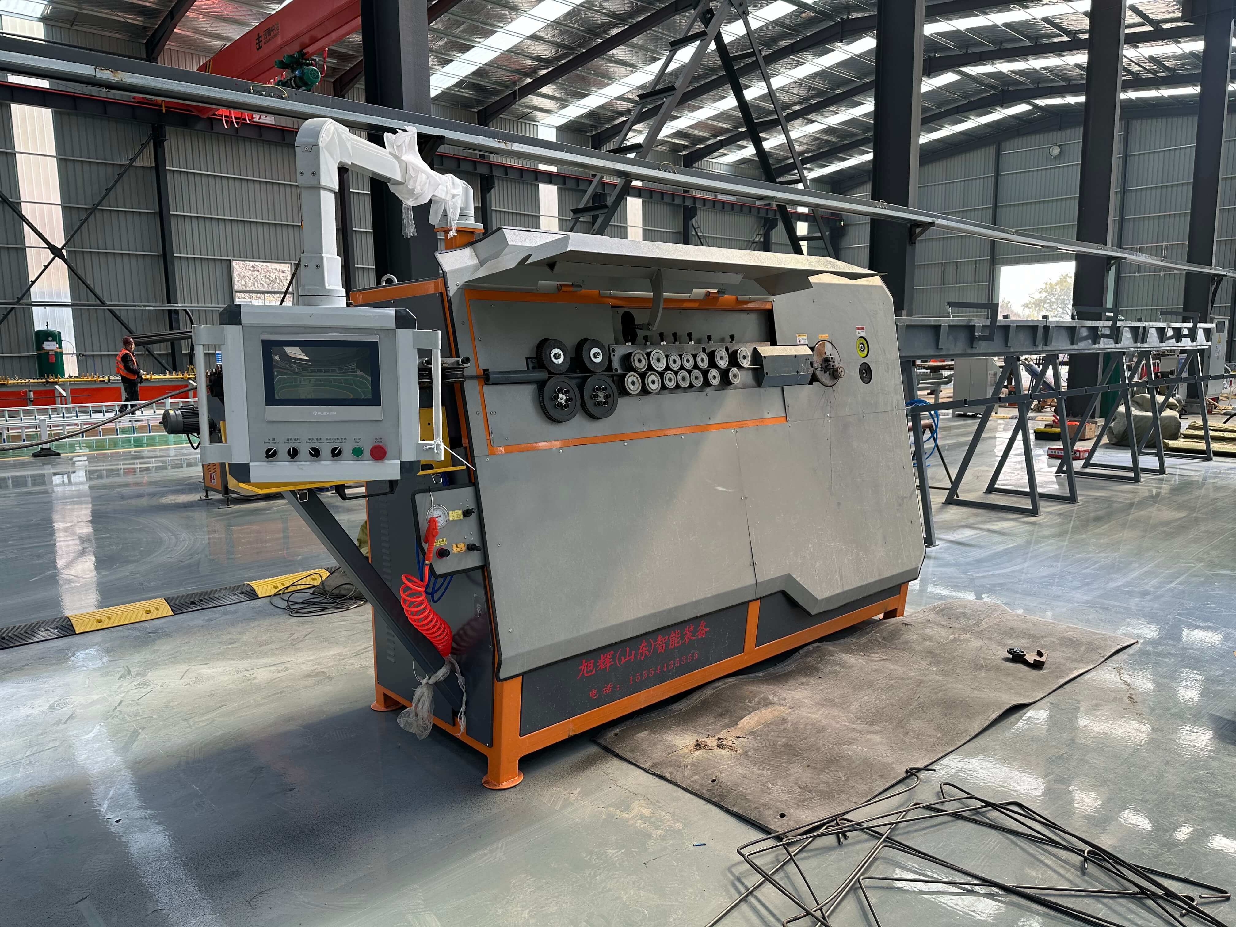Fully automatic CNC steel bar stirrup bender in operation