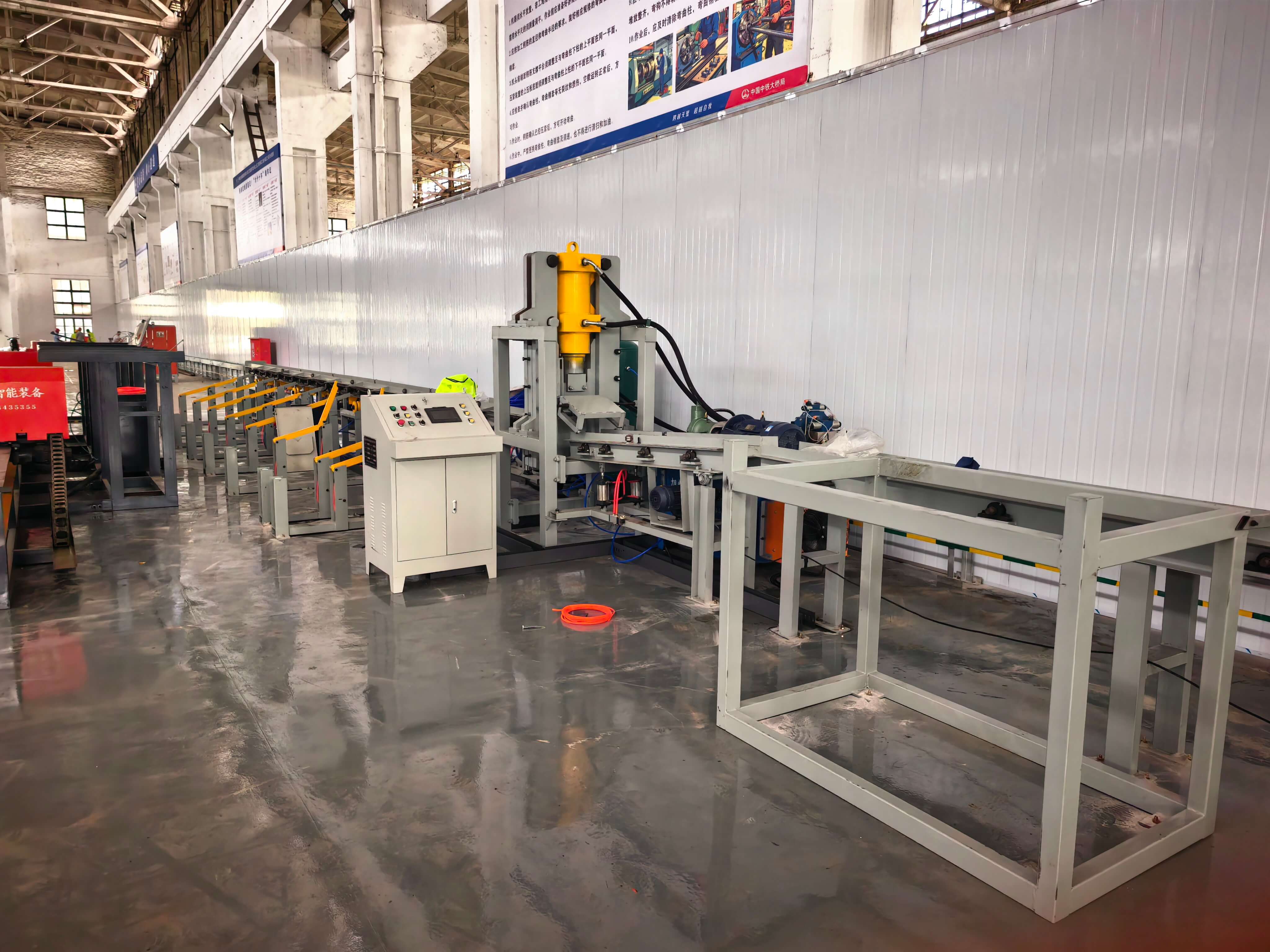 Automated steel bar processing equipment in operation