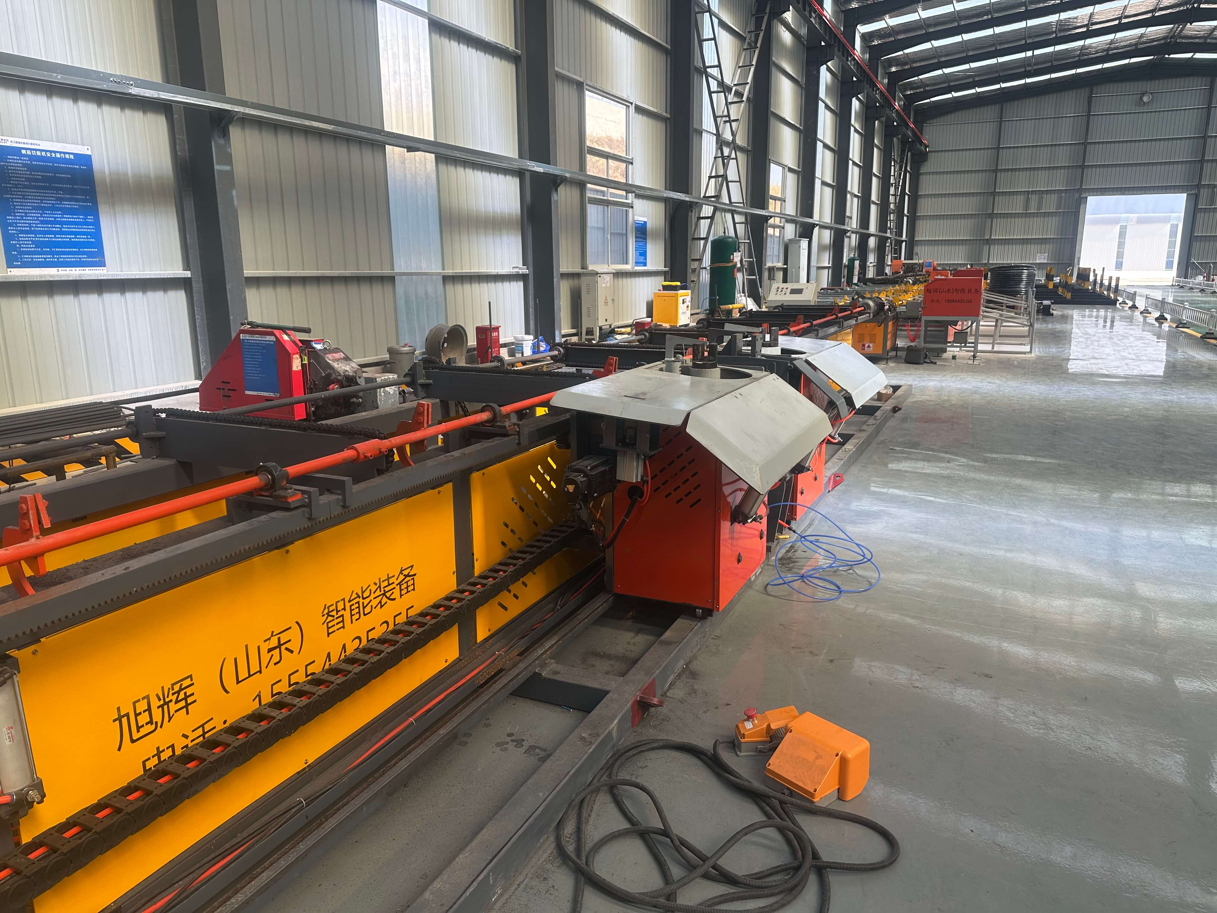Four-head horizontal CNC steel bar bending center in operation