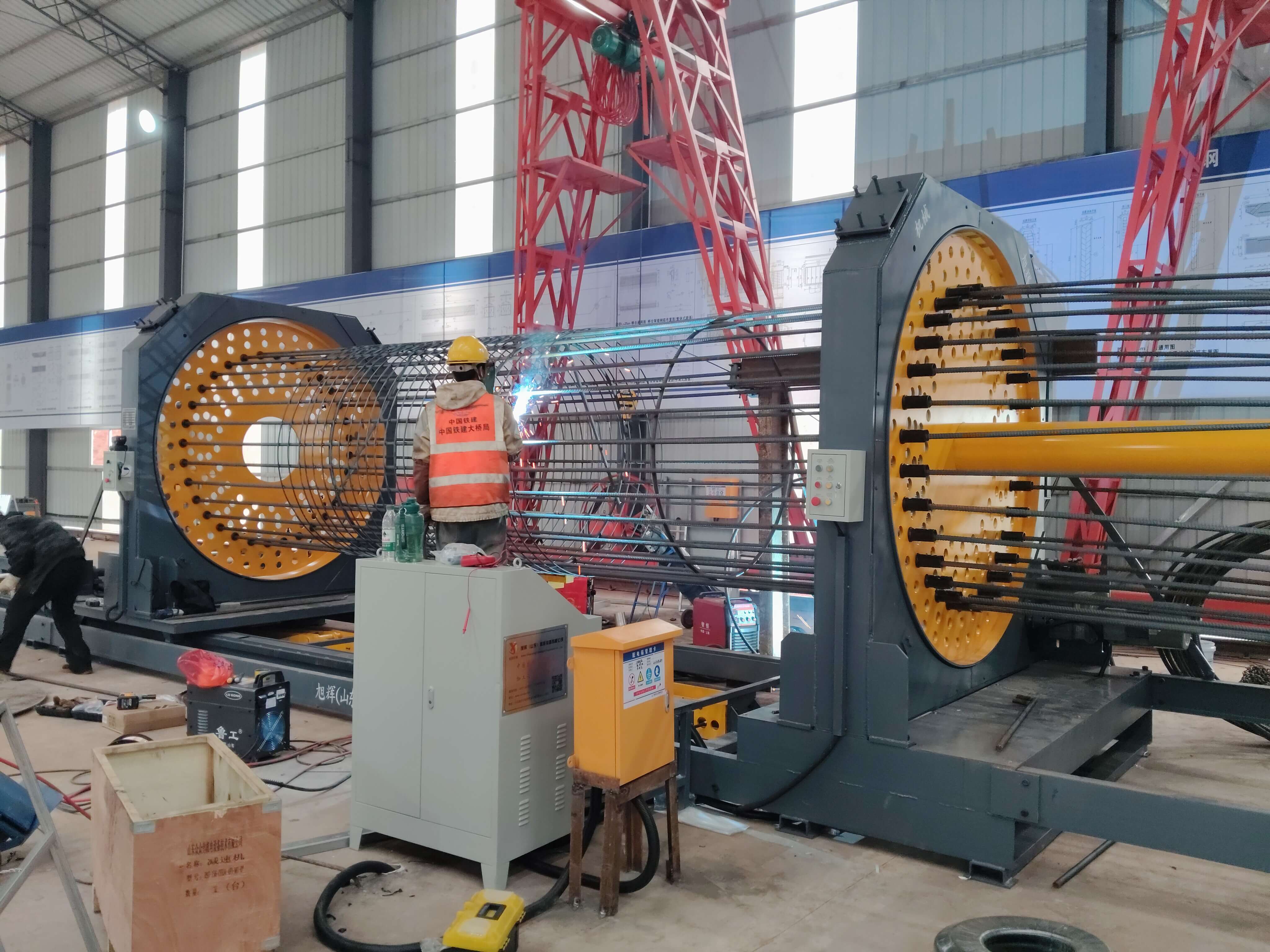 Fully automatic steel reinforcement cage rolling welder in operation