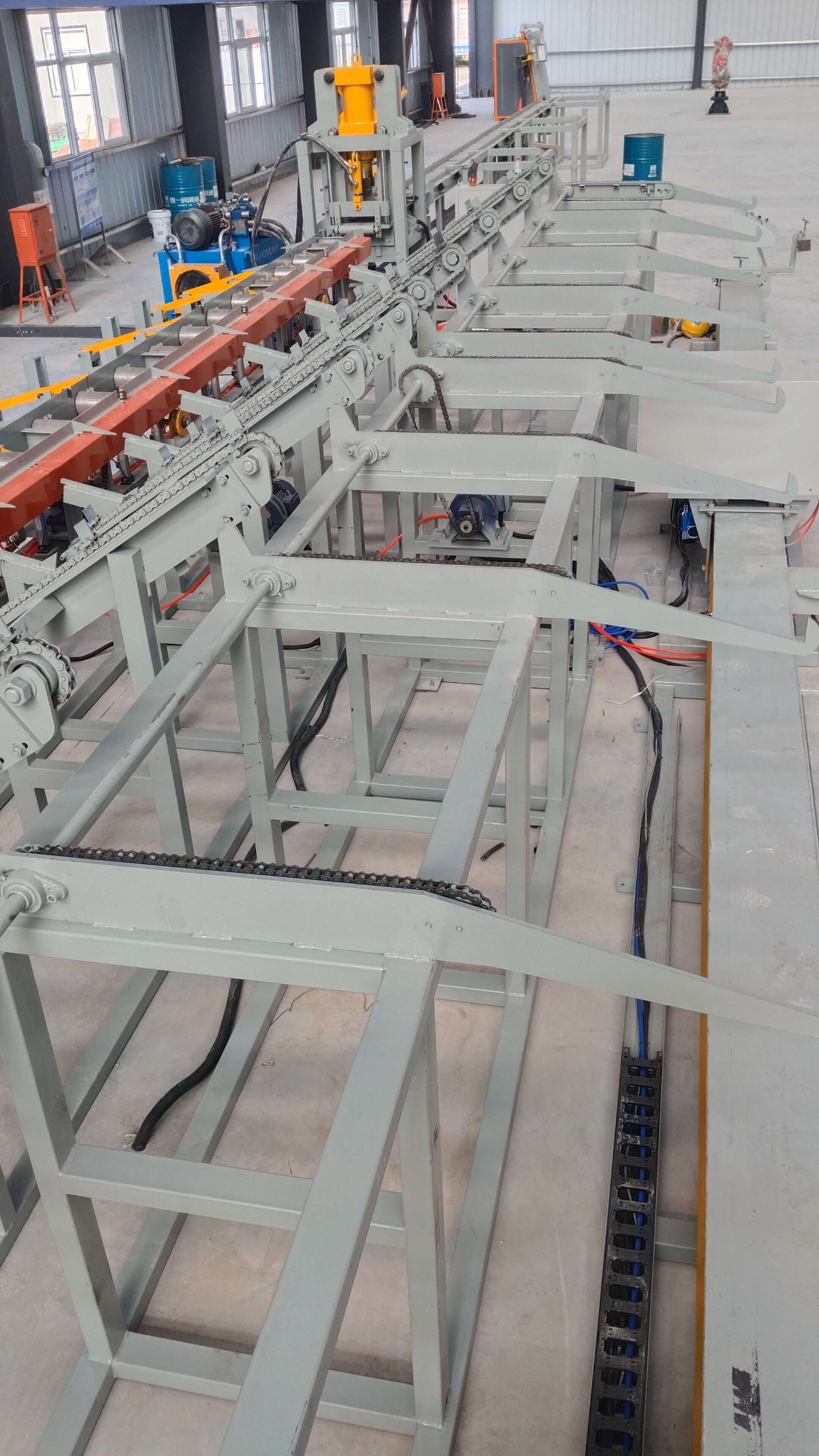 Rebar cutting line in industrial manufacturing facility