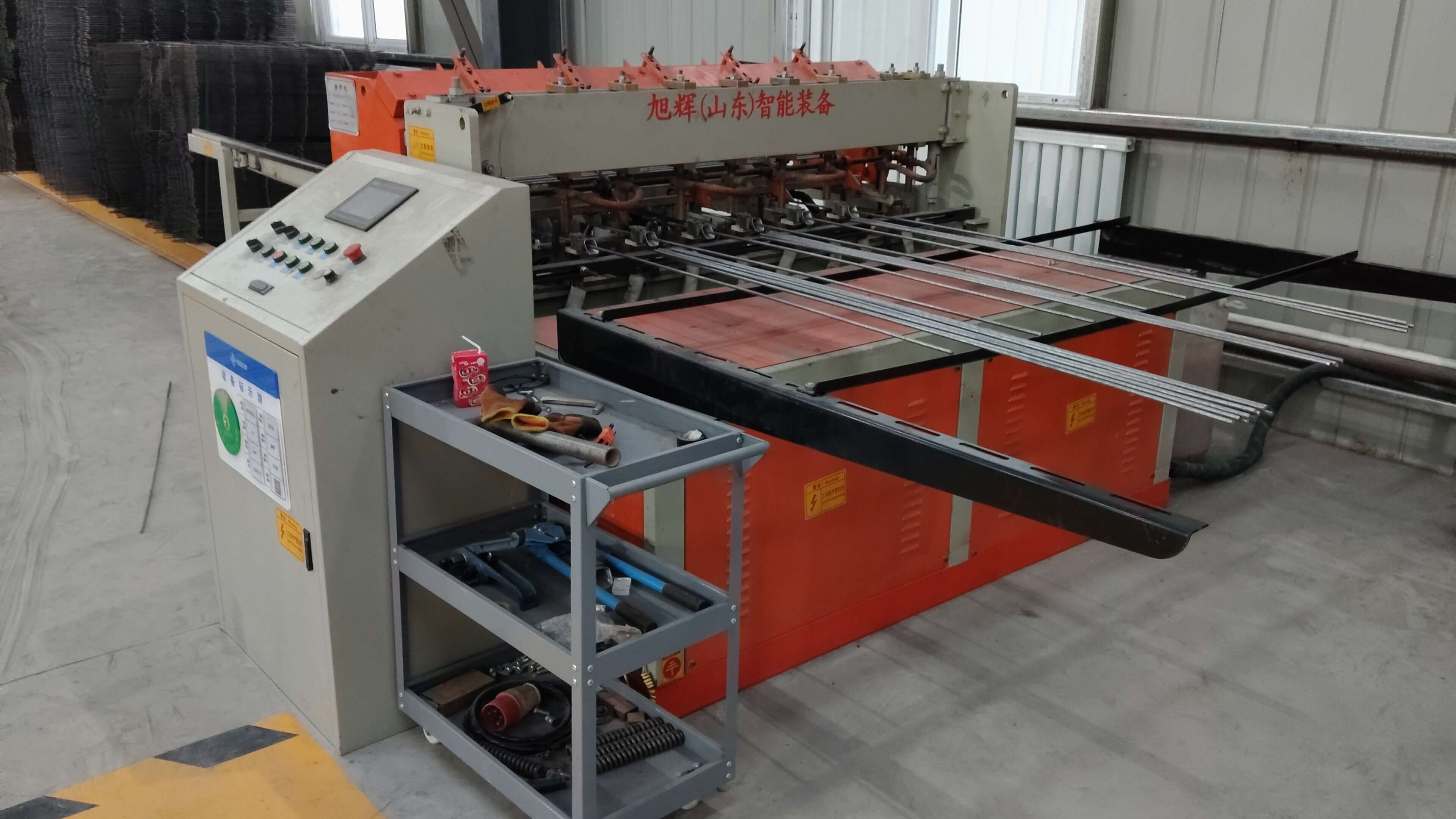 Automated steel mesh welding line in operation