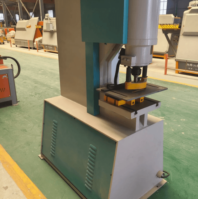 Automatic hydraulic punching machine in industrial setting