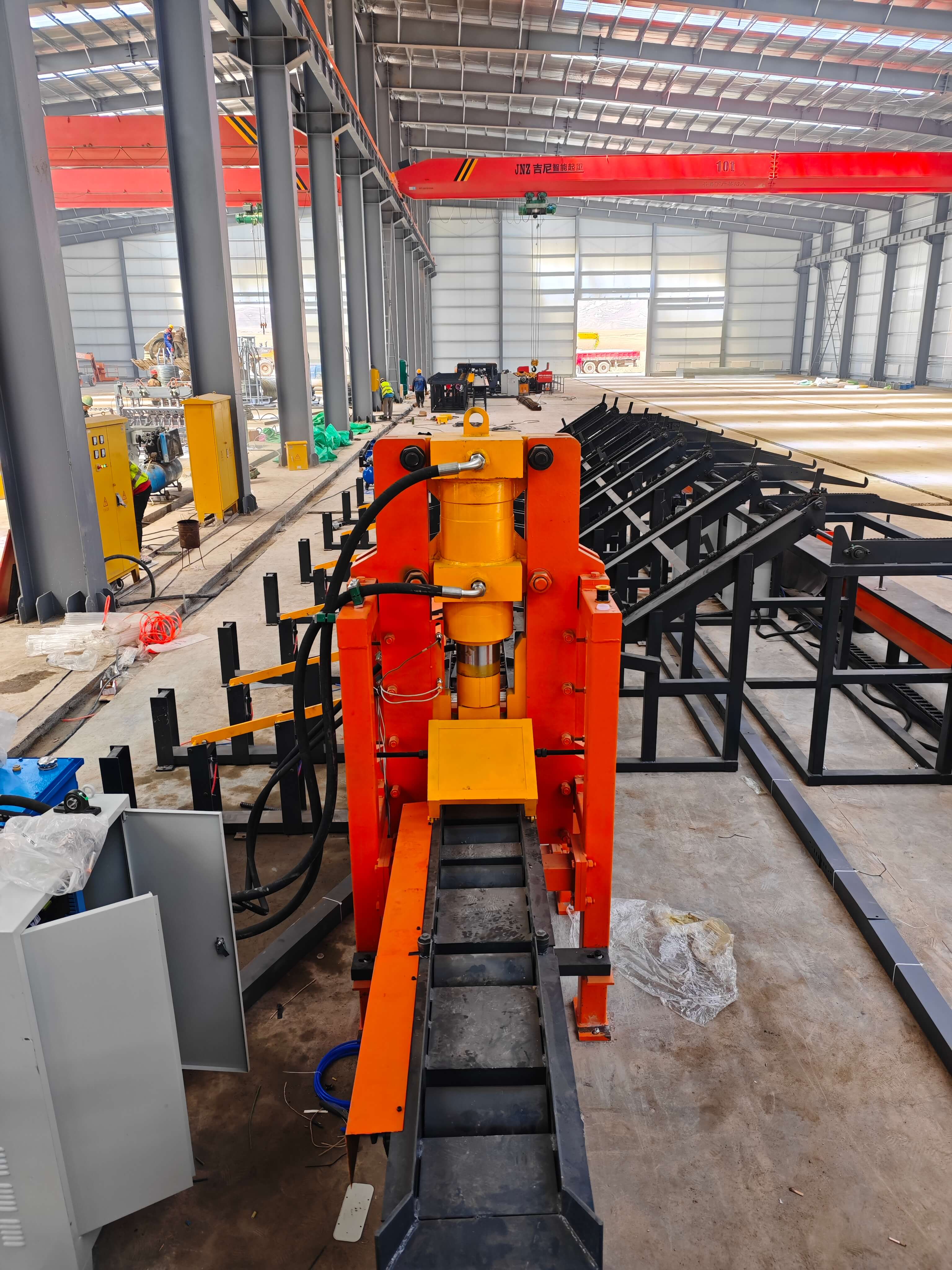 Automated steel bar processing equipment in operation