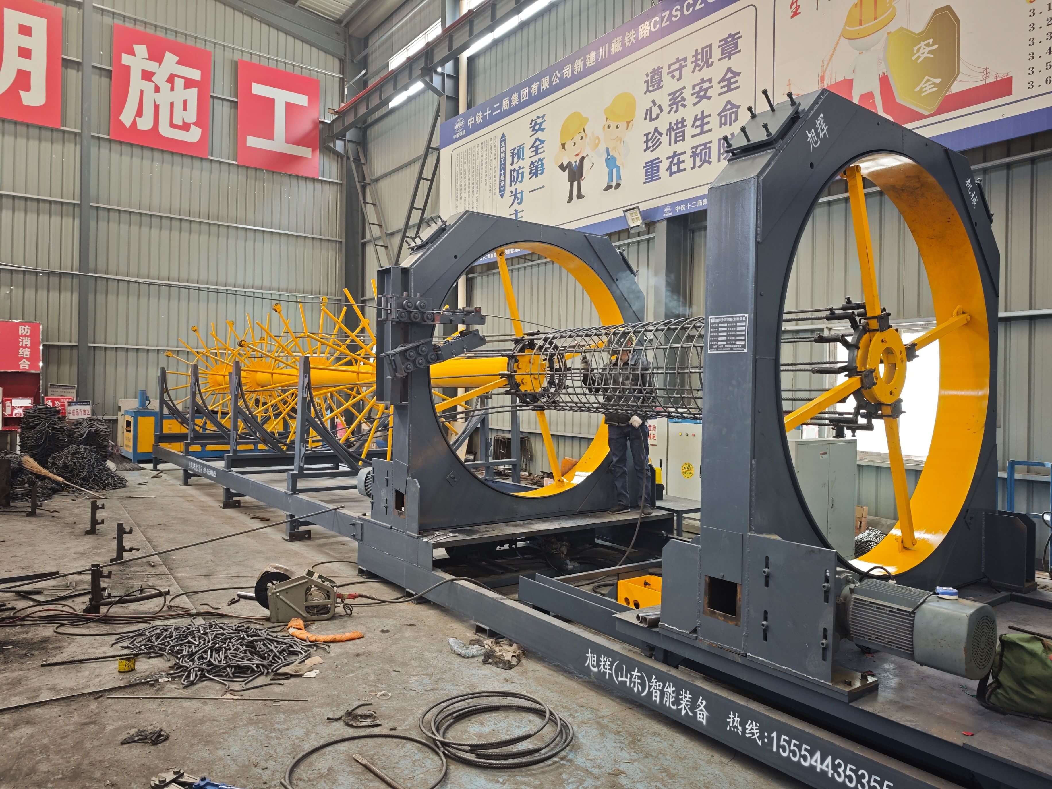 Fully automatic steel reinforcement cage rolling welder in operation