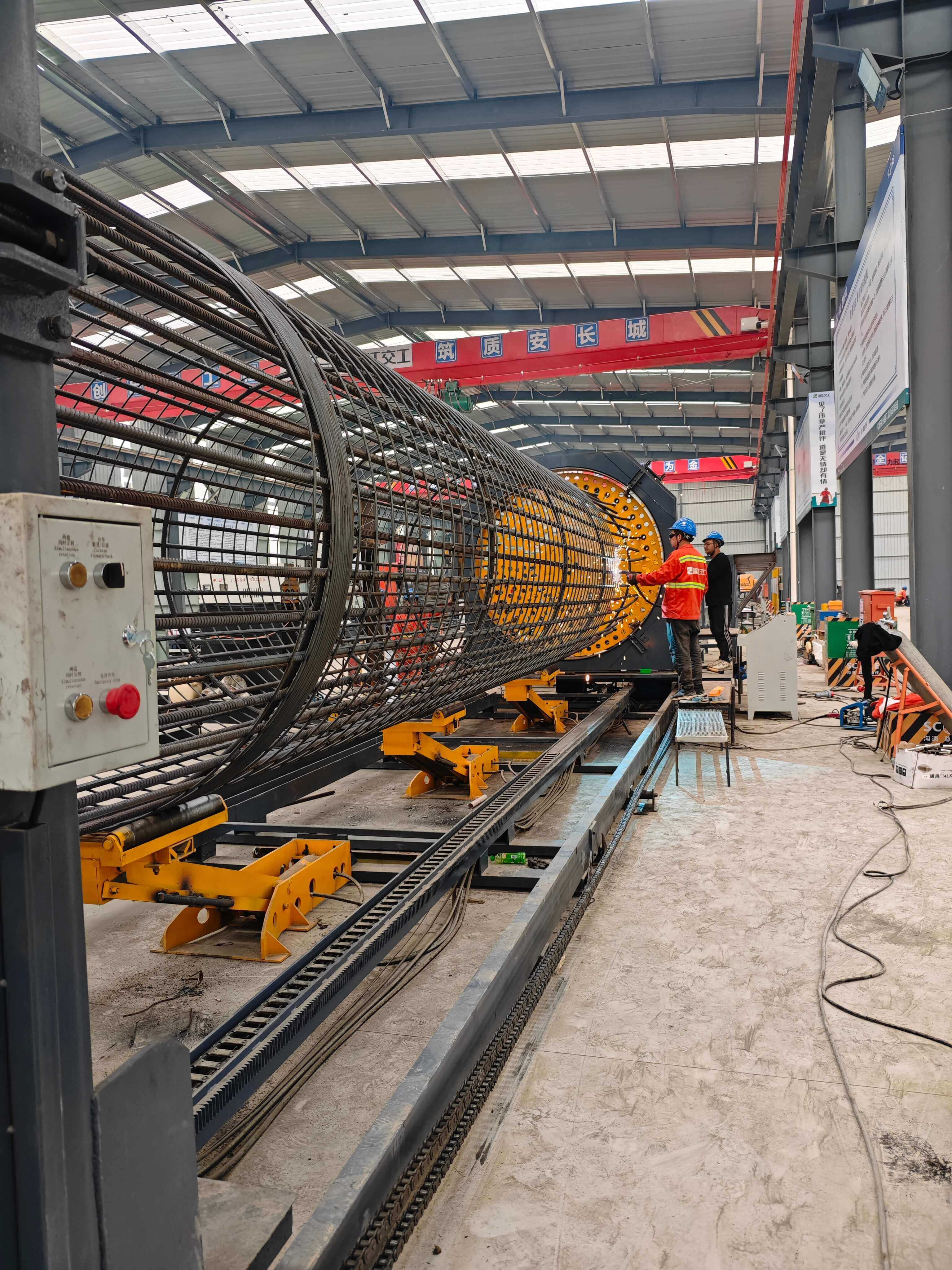 Steel reinforcement cage rolling welder in operation