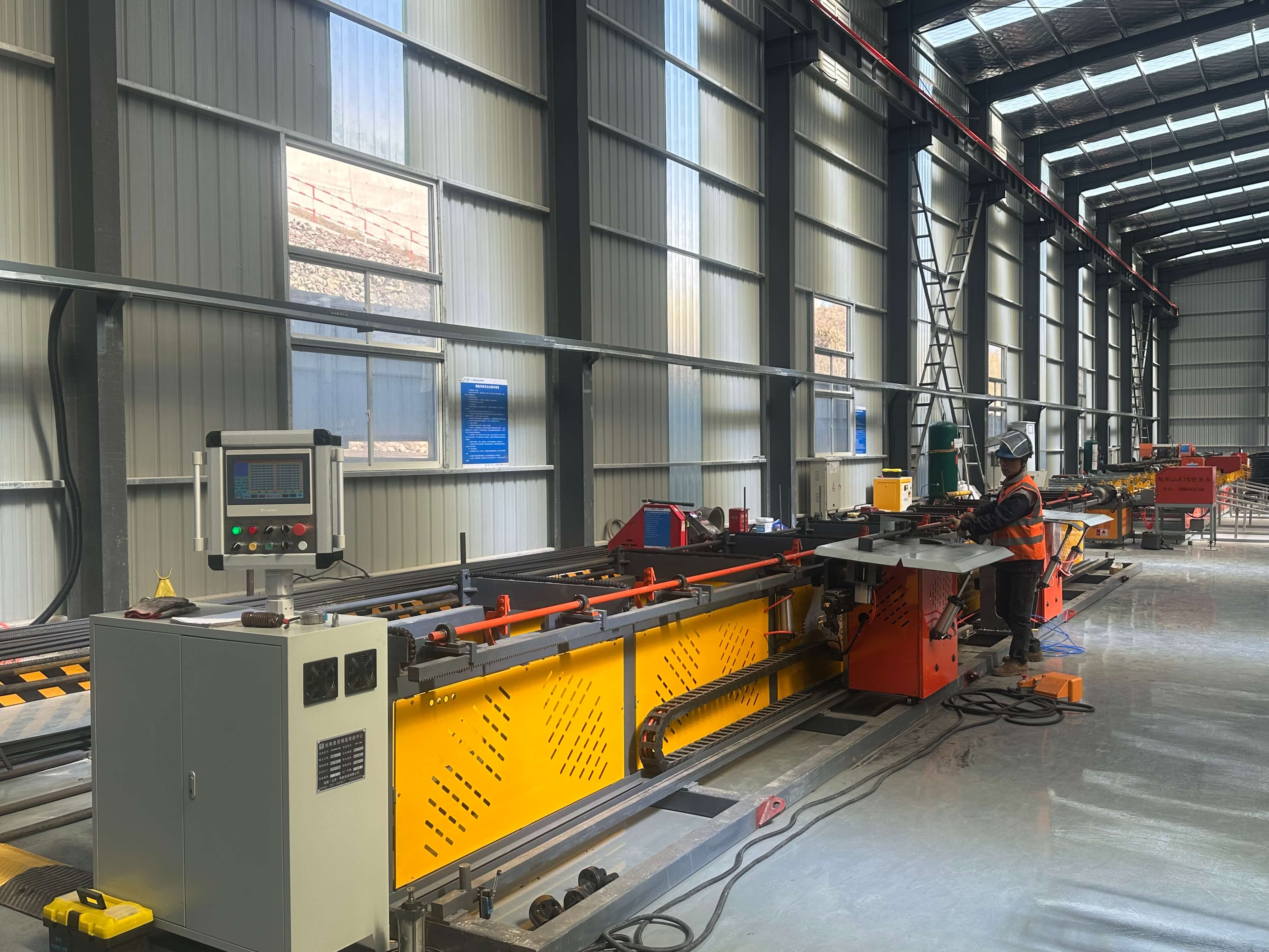 Horizontal four-head rebar bending center in operation