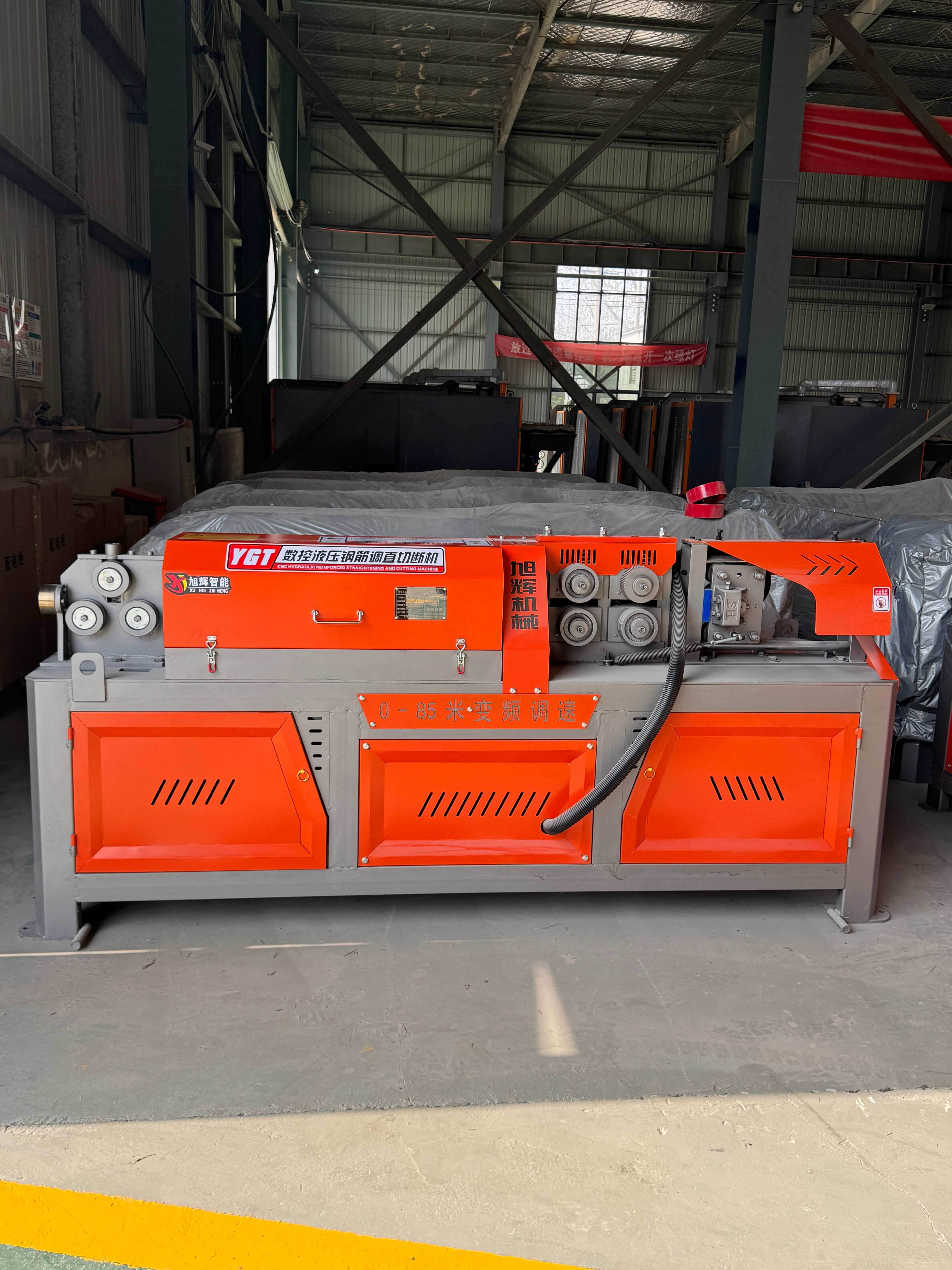 Hydraulic CNC steel bar straightening machine in operation