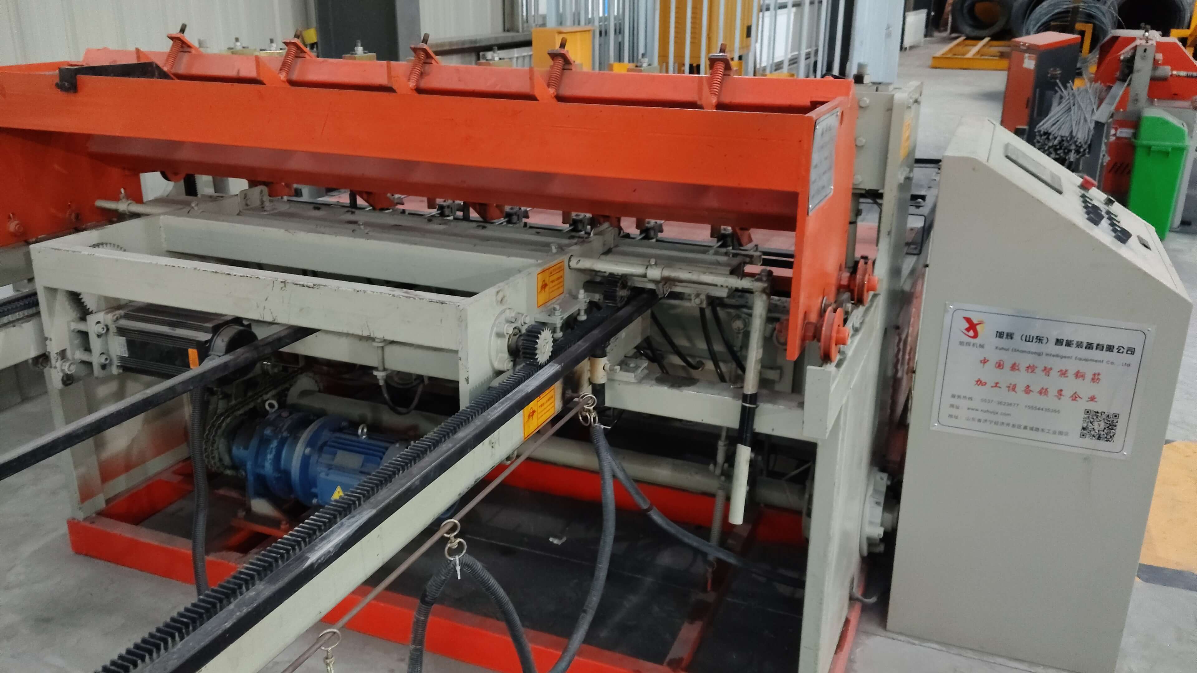 Automated steel mesh welding equipment in operation