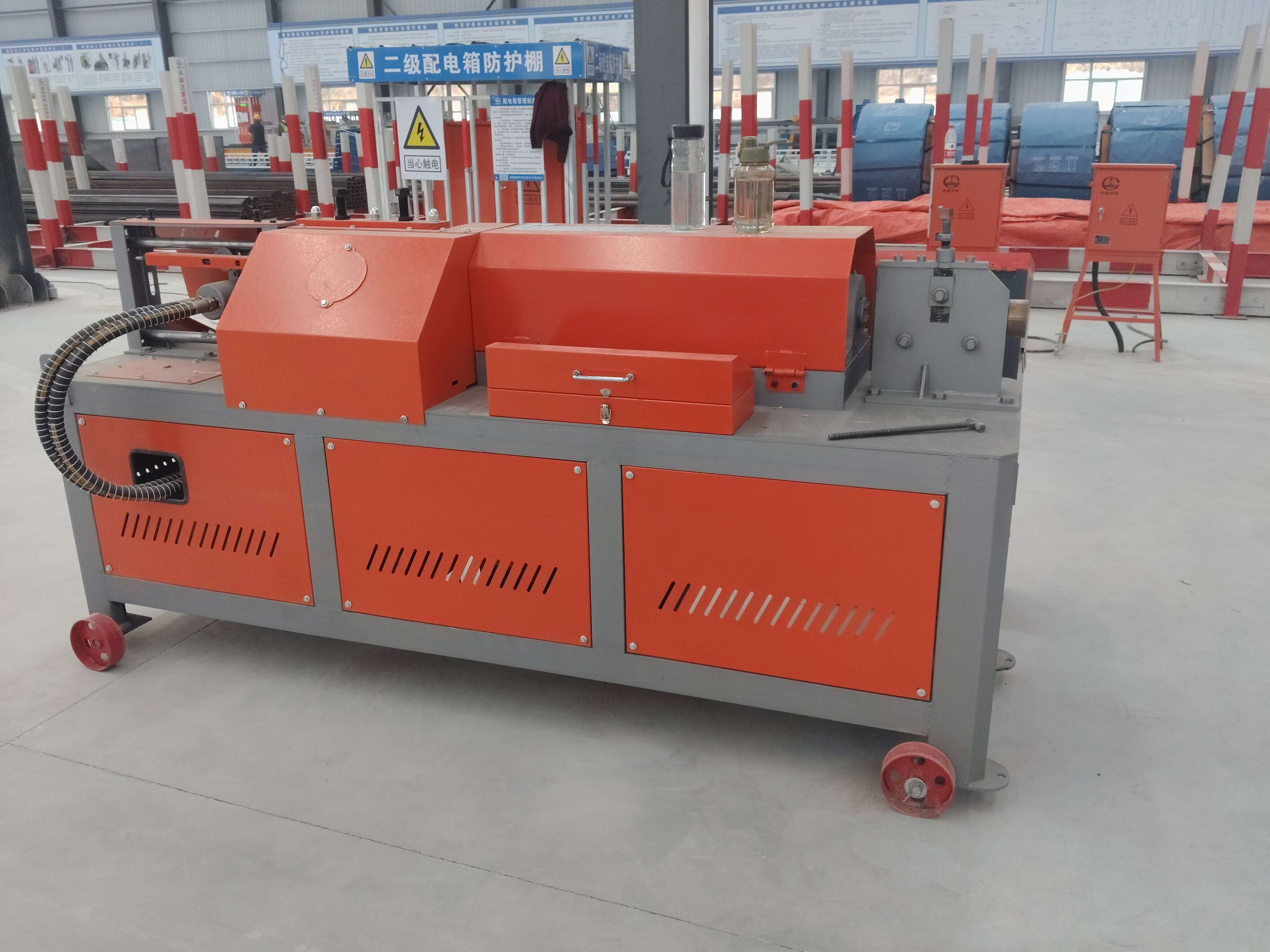 Industrial steel bar processing equipment in operation