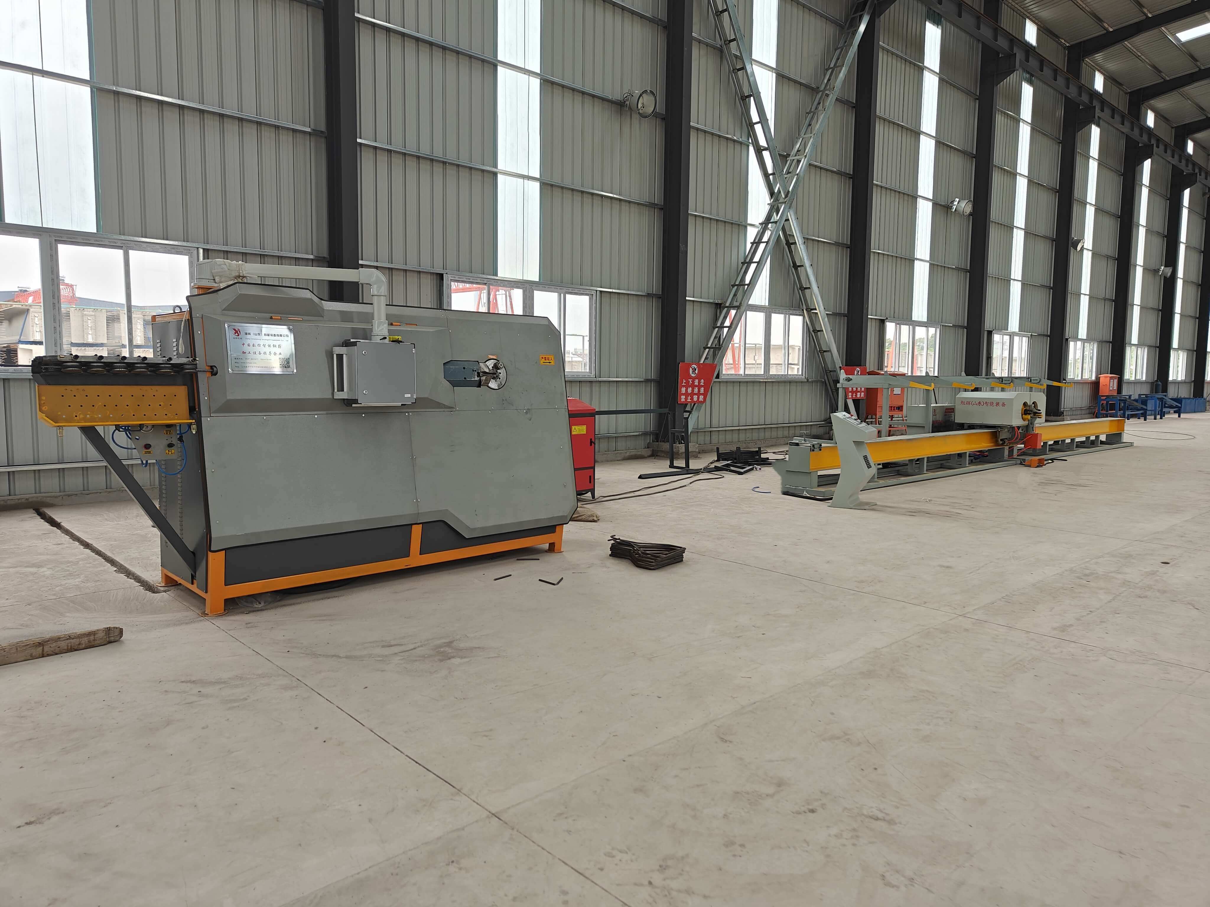 Four-head steel bar bending center in operation