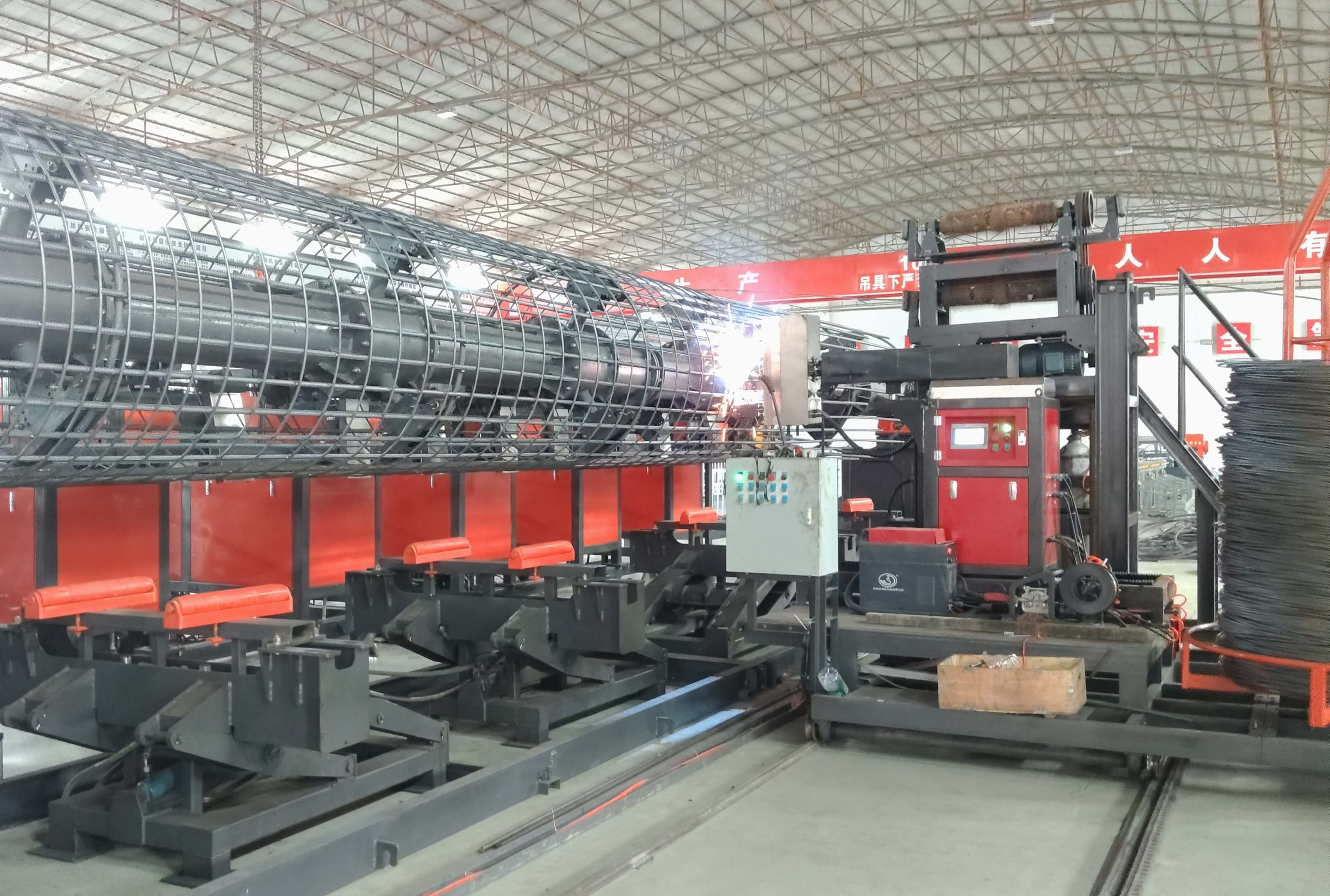 Automated steel reinforcement cage welding station in factory