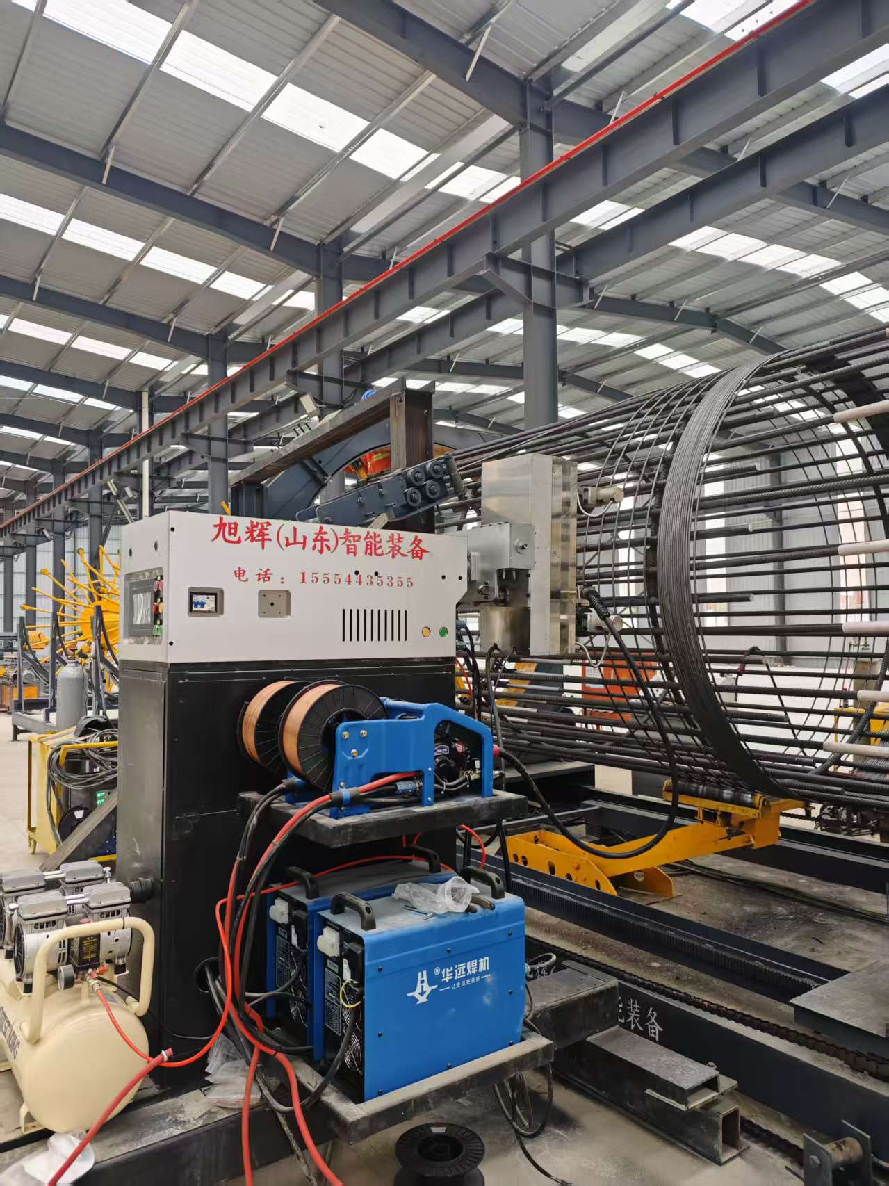 Steel reinforcement cage rolling welder in operation