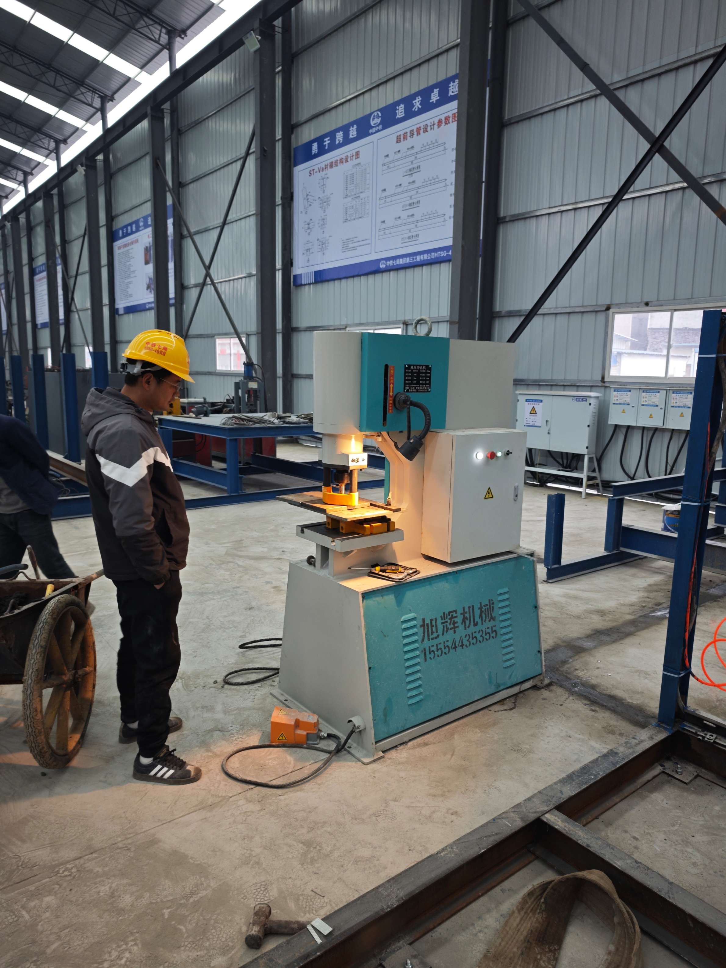 Industrial hydraulic punching machine in operation