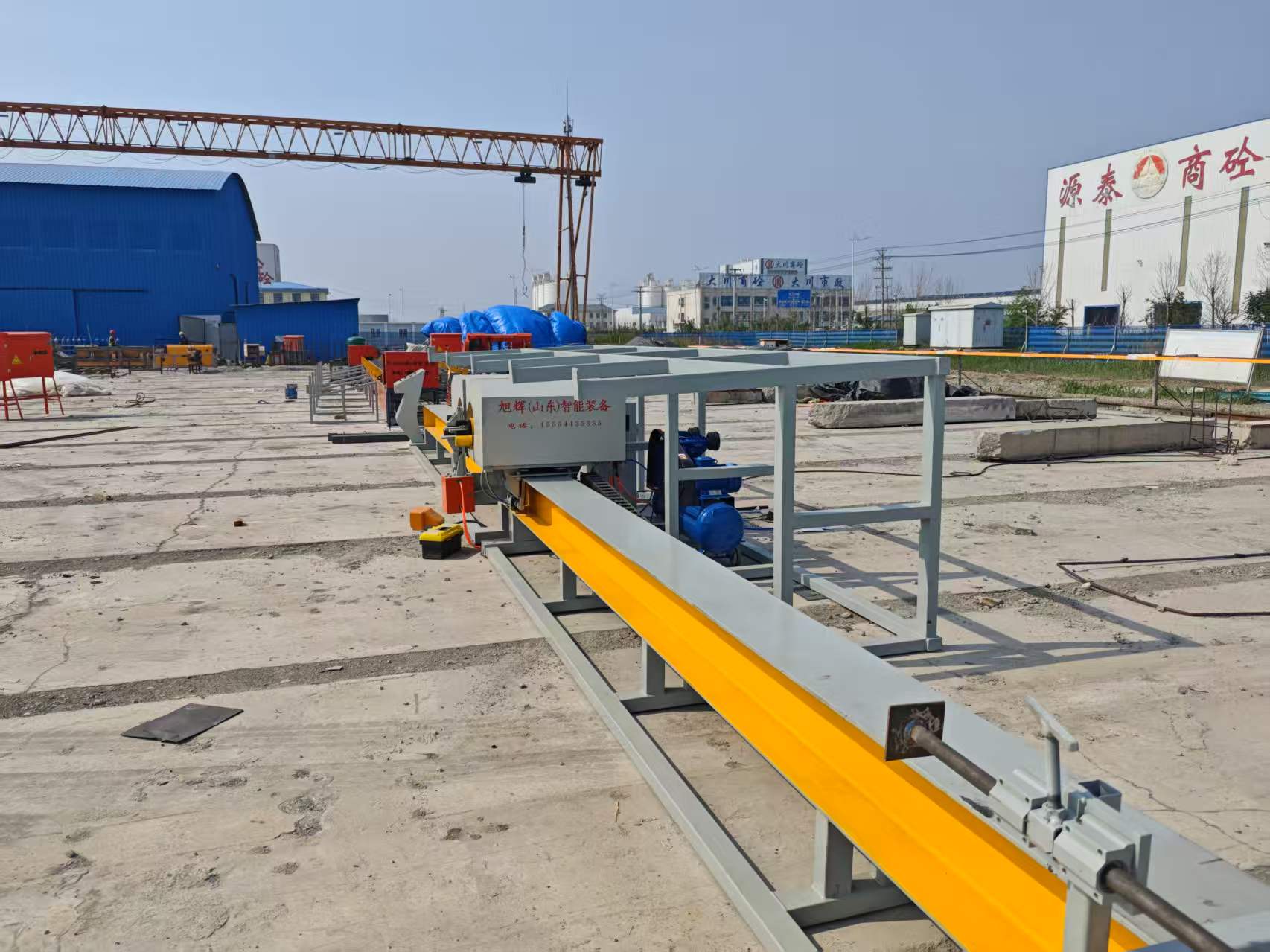 Technical team operating steel bar bending equipment
